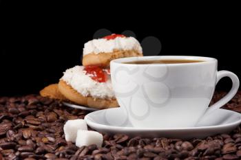 cup of coffee and sweet, cookies on beans