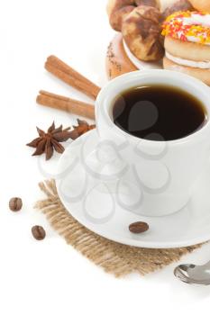 cup of coffee with beans and sweets isolated on white background