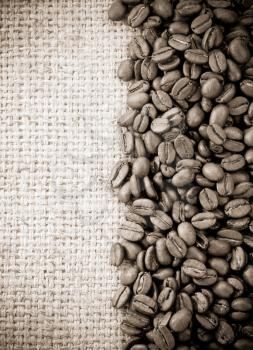 coffee beans on sack burlap texture background