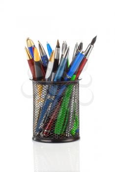 pens in holder basket isolated on white background