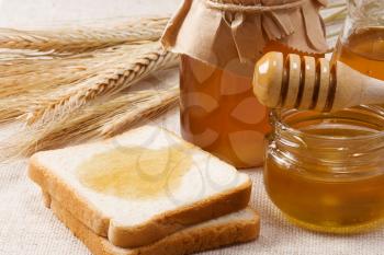 bread and honey on sacking