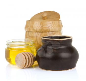 jars and pot of honey isolated on white background
