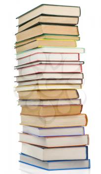 pile of new and old books isolated on white background