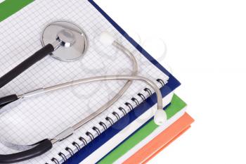 stethoscope on pad and books