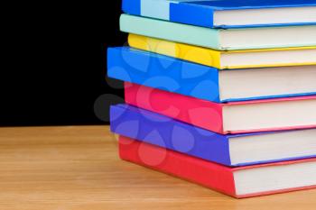 pile of books isolated on black background