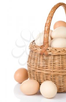 eggs and basket isolated on white background