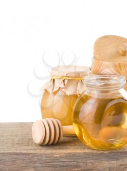 honey in jar isolated on white background