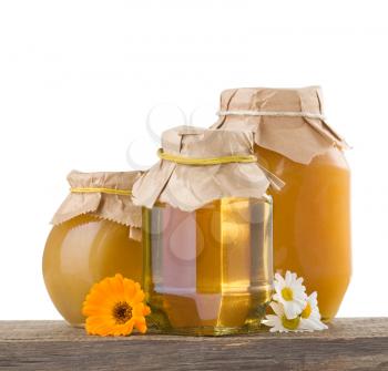 honey and flowers isolated on white background