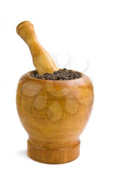 black spice pepper in mortar and pestle isolated on white background