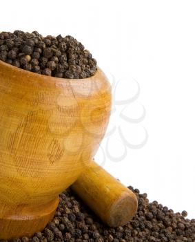 pepper and wooden pot isolated on white background