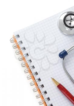 medical stethoscope  and notebook isolated on white background