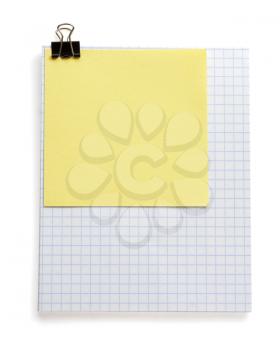 note checked paper and clip isolated on white background
