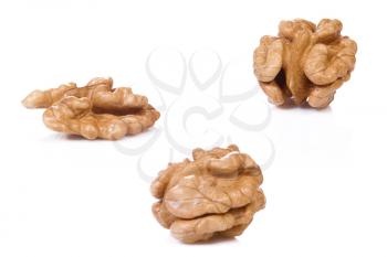 horizontal image of walnuts on white 