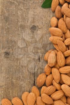 almond nuts on wood background
