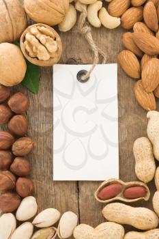 set of nuts fruit and tag label on wood background texture