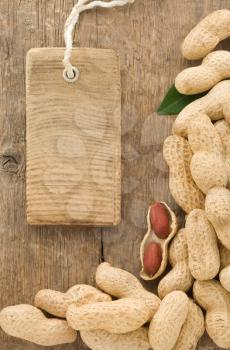 nuts peanuts fruit and tag price on wood background texture