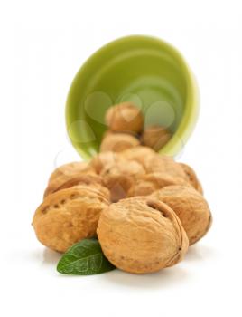 walnuts in bowl isolated on white background