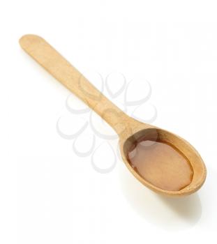 wooden spoon and honey isolated on white background