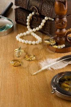image of old fashioned jewels and feather