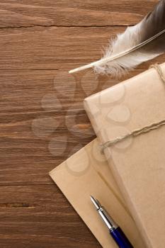 parcel and pen on wood background