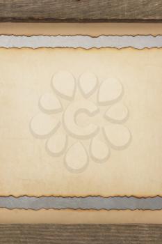 aged parchment paper and wood background