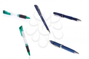 green and blue pens on white
