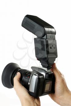 male hands holding camera with flash