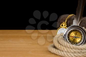 ship ropes and compass isolated on black background