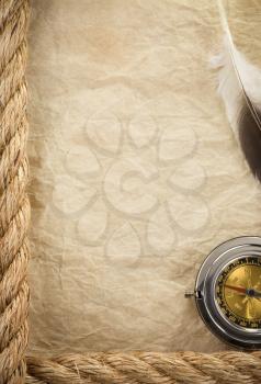 ropes and compass at old vintage ancient paper background texture