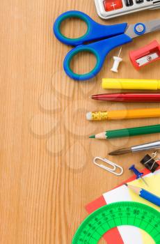 school accessories and supplies on wooden texture