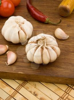 set of garlic nutrition and healthy food on wooden texture