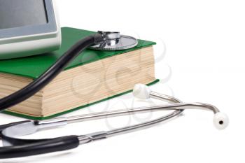 green old book and stethoscope