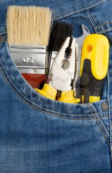 tools and instruments in blue jeans pocket