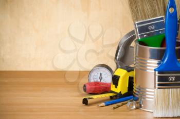 set of construction tools and instruments on wood background