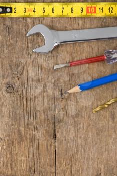 set of tools on wood background