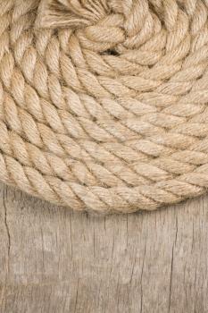 ship ropes and knot on wood background texture