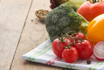 fresh vegetable and food ingredients on wood background