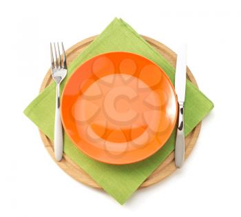 plate and fork with knife at napkin cloth on white background