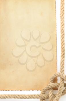 ropes and old paper isolated on white background