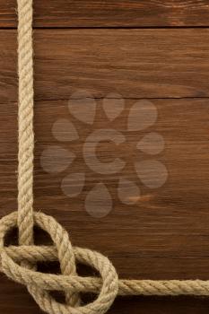 ship ropes on wooden background