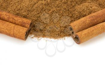 cinnamon stick and powder isolated on white background