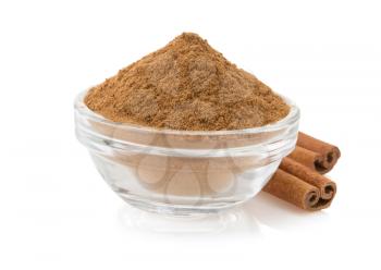 cinnamon in bowl isolated on white background