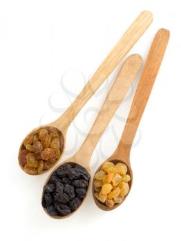 raisins fruit in spoon on white background