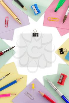 school supplies and note paper on white background