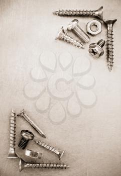 bolts, screws and nuts tool at metal background texture