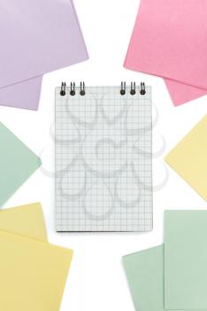 checked notebook  and note paper  on white background