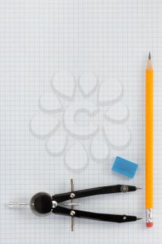 pencil at checked paper background texture