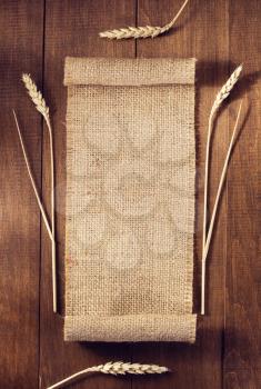 ears of wheat on wooden background