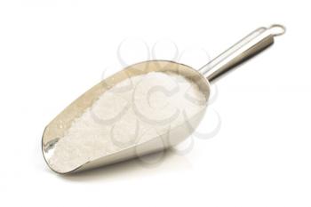 granulated sugar in scoop isolated on white background