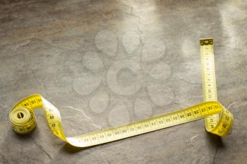 measuring tape on table background